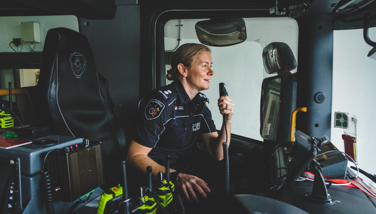 Female firefighter with radio